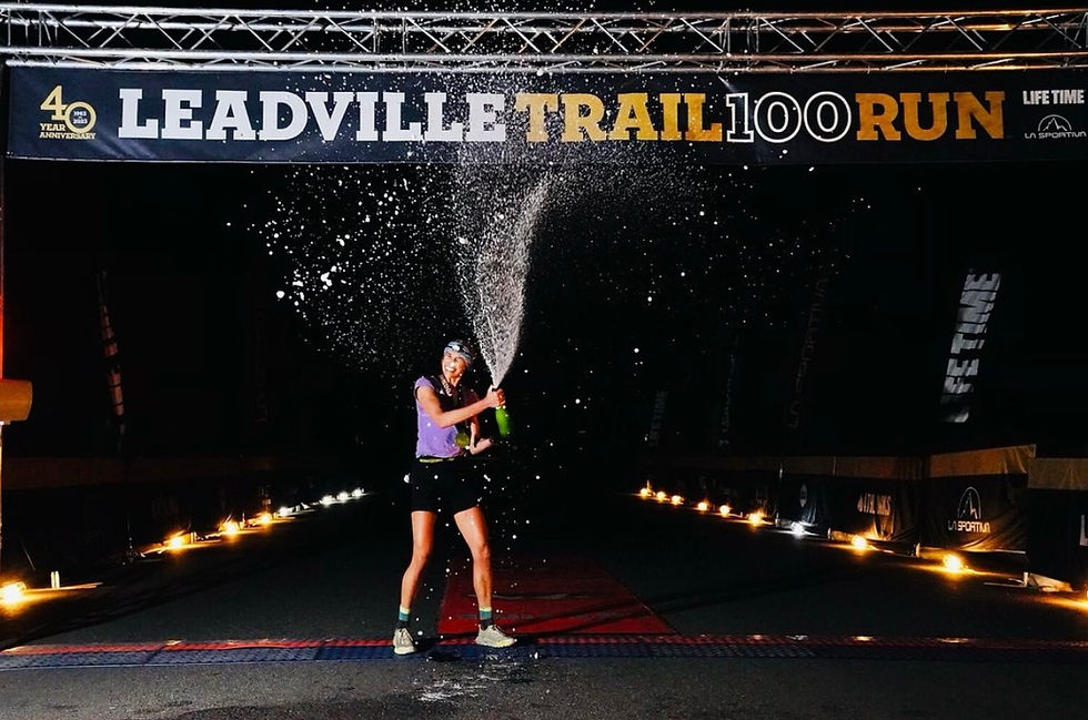 Jacquie Mannhard, winner of the 2023 Leadville 100, celebrated with a champagne spary.