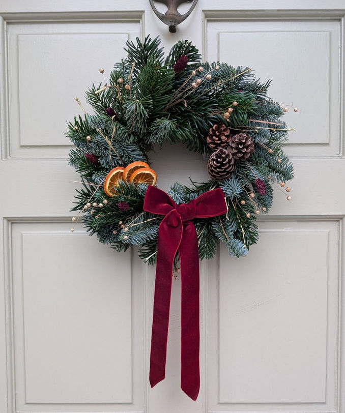 Jar and Fern wreath hanging on door