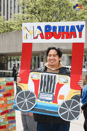 staff poses with the Jeepney prop