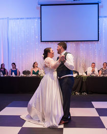 dancefloor bride and groom first dance wedding party