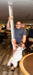 Bill Cahill, AD8BC, holding his new antenna.