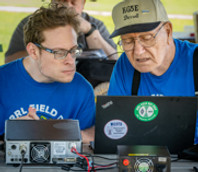 Collin Swain KG5ELO at the radio with Darrell Crimmins KG5E.