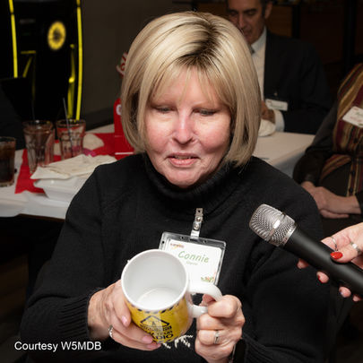 Connie Norris looking at her Ham Radio Mug.