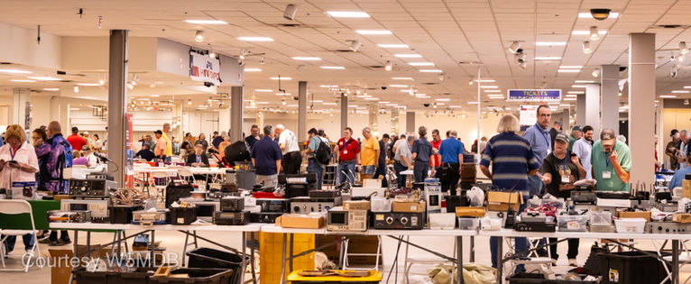 Wide angle showing the tables and attendees.