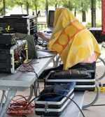 Ken Wendel, W5RPS, under a blanket draped over his head and shoulders.