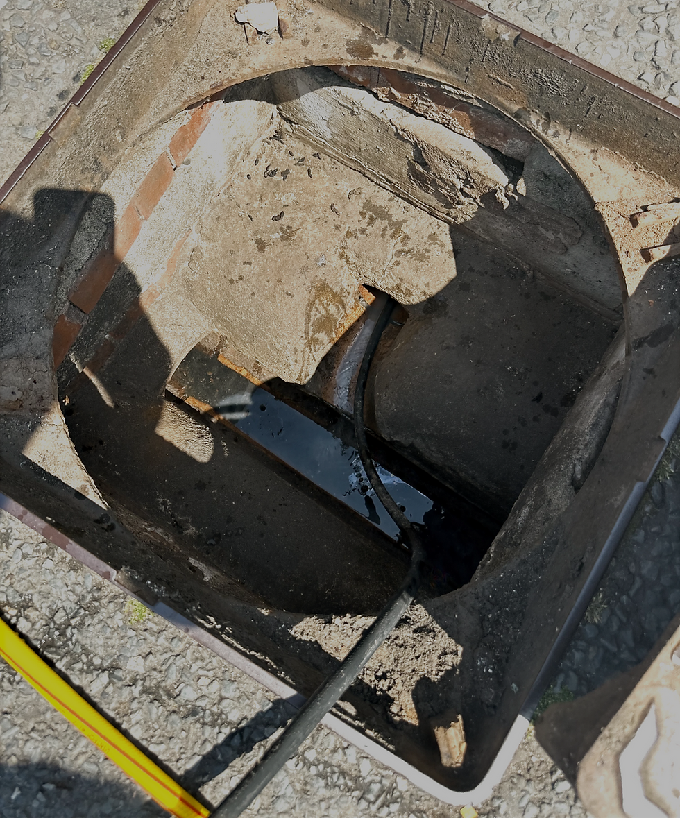 Drain jetting to clear a drain which has a blockage.