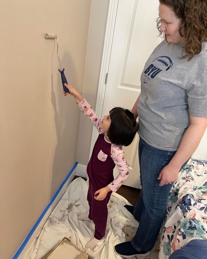 Helping to repaint the wall with a fresh coat