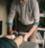 Therapist checking leg lengths