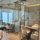 Glass-partitioned meeting area in Genesis Real Estate office, Dubai