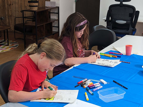 Children working on their artwork during an Arthouse kids and teens art class in Long Buckby