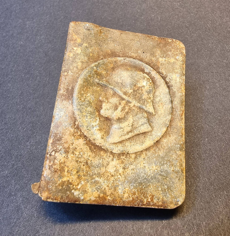 This matchbox cover has a depiction of what appears to be the profile of a german soldier wearing a helmet.