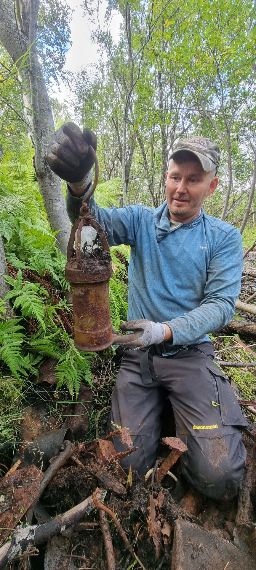 person holding up a lantern