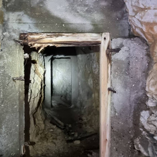 Tunnel leading in to larger halls