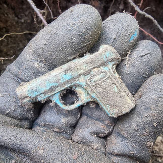 A small pistol shaped pencil sharpener.