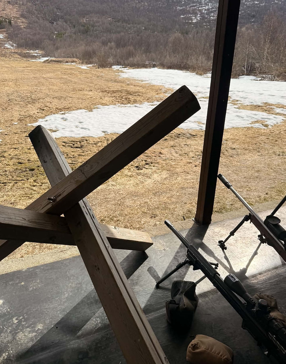 two rifles on the PRS shooting range.