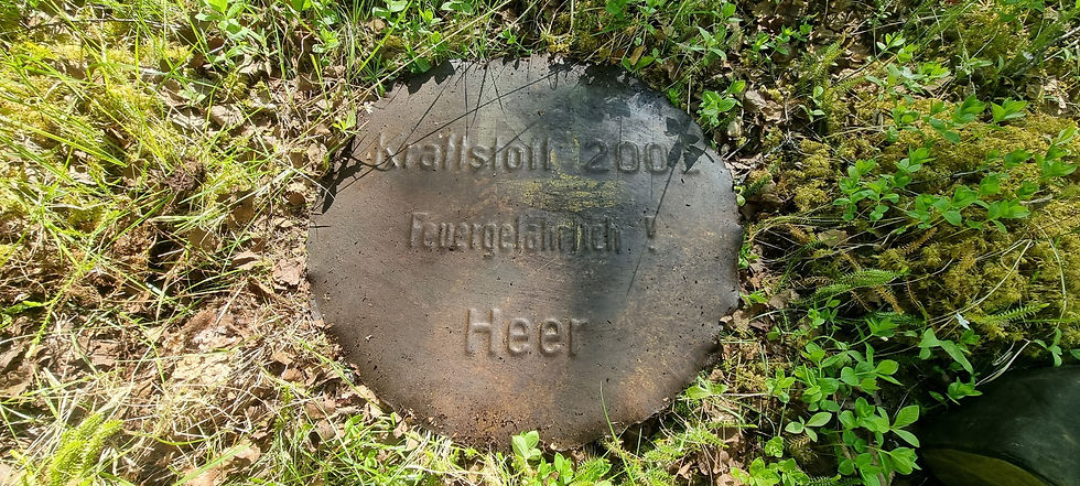 round metal plate with german text