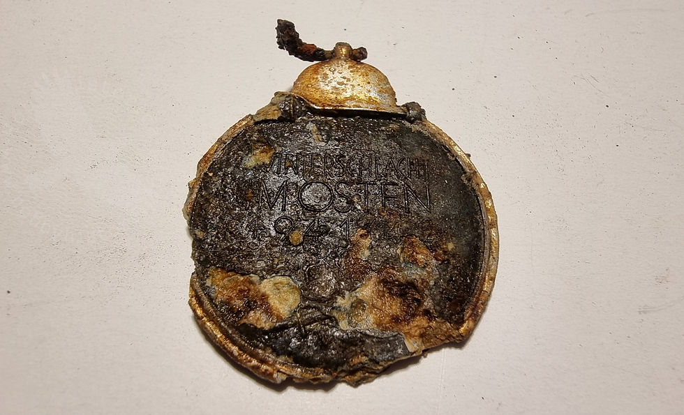 deteriorated round medal