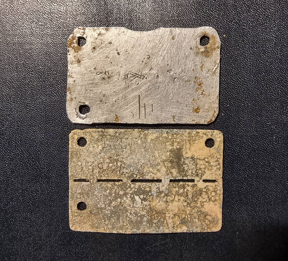 a handmade blank stalag tag, and a stamped one from stalag II D