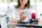 A woman holding an insurance card