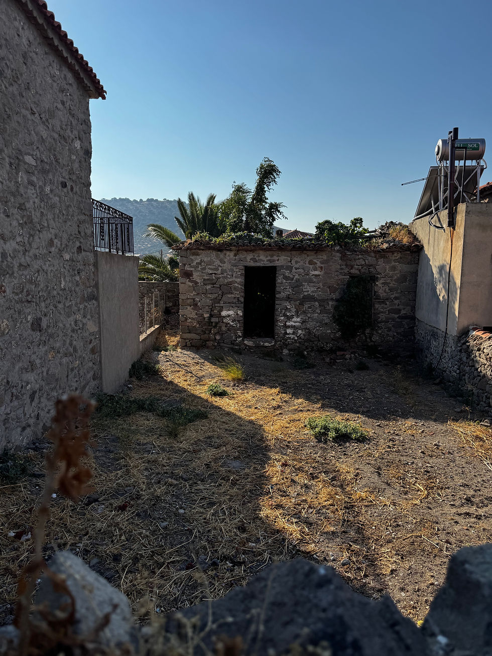 Eressos, Lesvos. Stone House with a large courtyard for sale.