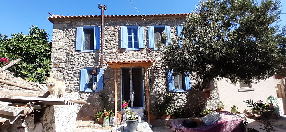 Eressos, Lesvos. Traditional two-story stone house for sale, with a large courtyard.