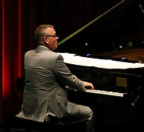 Tony Nalker playing piano.