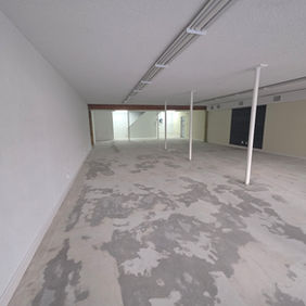 Commercial concrete floor after professional coating removal and surface preparation by Raz-Barry Coatings in Ormond Beach, FL.