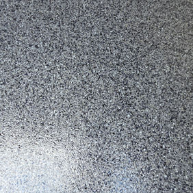 Close-up of smokey blue flake floor coating with a durable decorative finish.