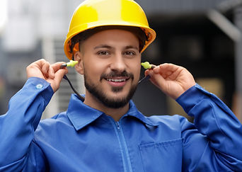Hard hat worker uses earplugs on the job_edited.jpg