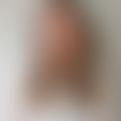 Headshot of Sophie Scott smiling against a neutral background