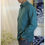 Thumbnail: man standing indoors with hand in trouser pocket wearing turquoise coloured nettle fibre collared shirt