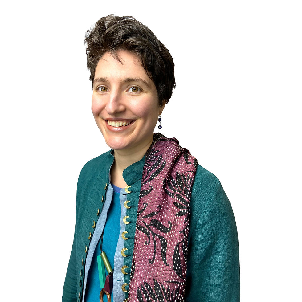 Thumbnail: woman smiling in blue dress wearing sergeant pepper teal nettle coat and having silk scarf draped over shoulder