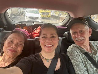 Huyen with mother and adoptive father