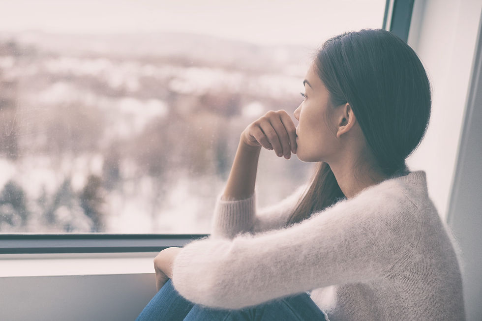 Sad pensive woman at home Winter depression - seasonal affective disorder mental health lo