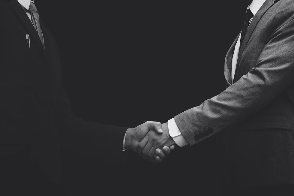 business-partners-shaking-hands-monochrome.jpg