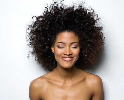 Portrait of a Smiling Woman with Curly Hair
