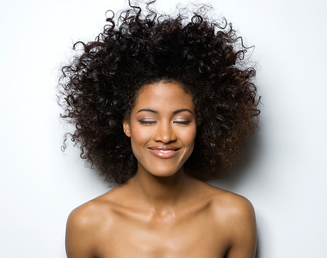 Portrait of a Smiling Woman with Curly H