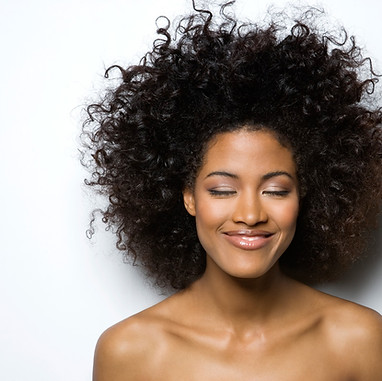 Portrait of a Smiling Woman with Curly H