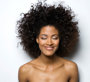 Portrait of a Smiling Woman with Curly Hair
