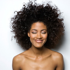Portrait of a Smiling Woman with Curly Hair