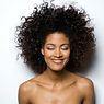 Portrait of a Smiling Woman with Curly H