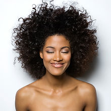 Portrait of a Smiling Woman with Curly H