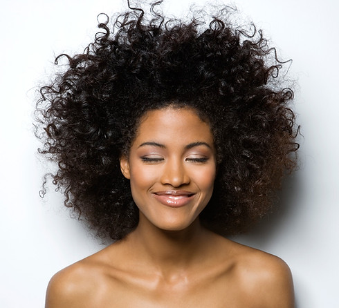 Portrait of a Smiling Woman with Curly H