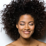 Portrait of a Smiling Woman with Curly Hair