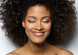 Portrait of a Smiling Woman with Curly Hair