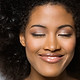 Portrait of a Smiling Woman with Curly Hair