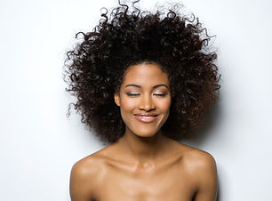 Portrait of a Smiling Woman with Curly H