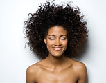 Portrait of a Smiling Woman with Curly H