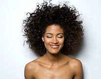Portrait of a Smiling Woman with Curly Hair