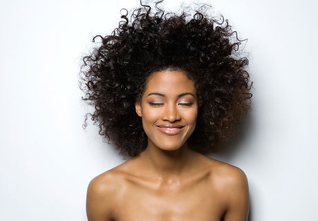 Portrait of a Smiling Woman with Curly Hair